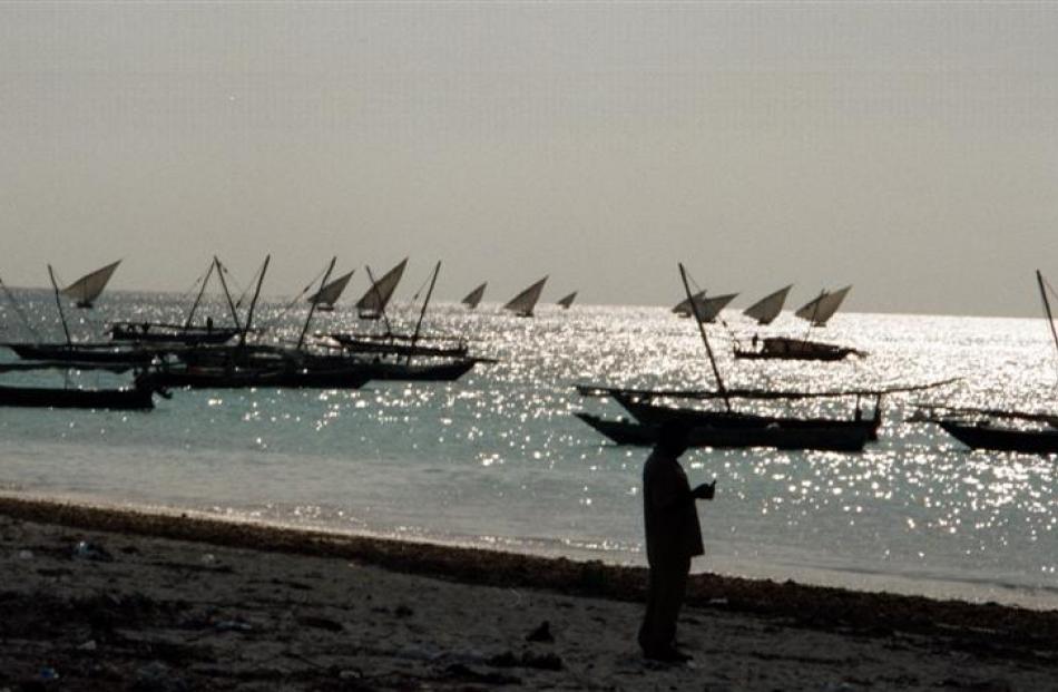 Fishing dhows make their way out to the Indian Ocean. Photos by Alistair McMurran.