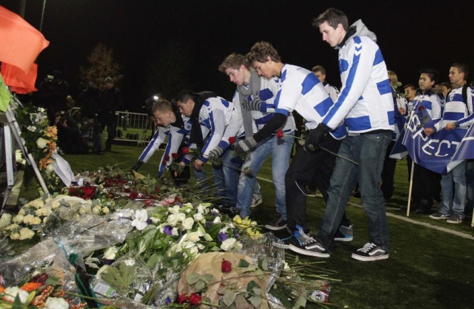 Football fans leave flowers as tribute to linesman Richard Nieuwenhuizen at Almere, Netherlands,...