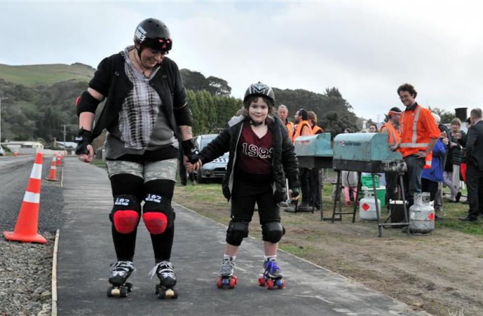 Rachel Wesley and daughter Mihi Wesley-Evans (7) enjoy skating on a section of the new footpath...