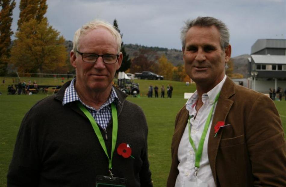 Former Alexandra players Ken Paulin (left) and Peter Mitchell stand on the sidelines at the...