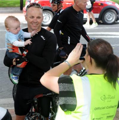 Former All Black Christian Cullen holds 5-month-old Jordan McEwan, a former neonatal intensive...