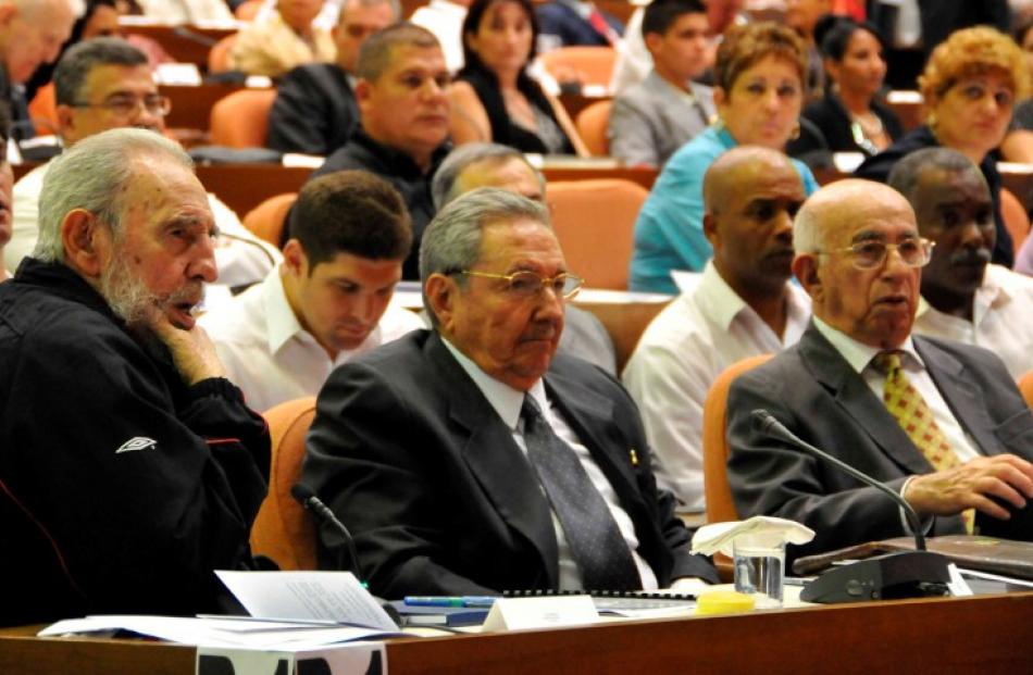 Former Cuban leader Fidel Castro, (L), attends the opening session of the National Assembly of...