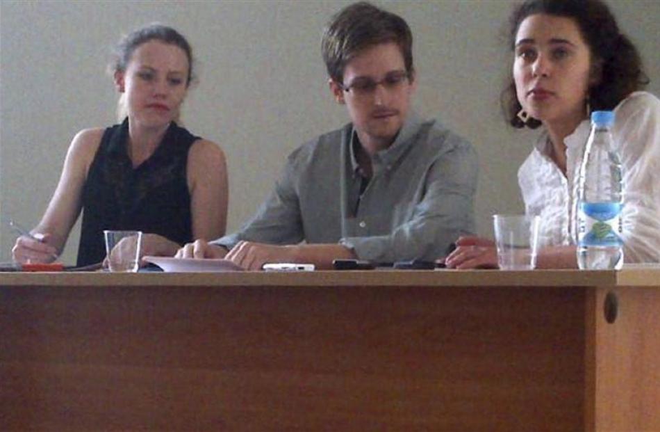 Former intelligence agency contractor Edward Snowden and Sarah Harrison (left), of WikiLeaks,...