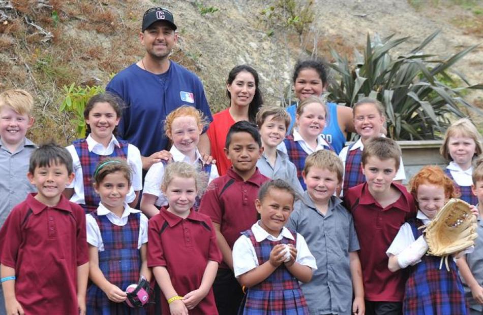 Former Major League Baseball pitcher DJ Carrasco and wife Autumn Lopez (at rear) surrounded by St...