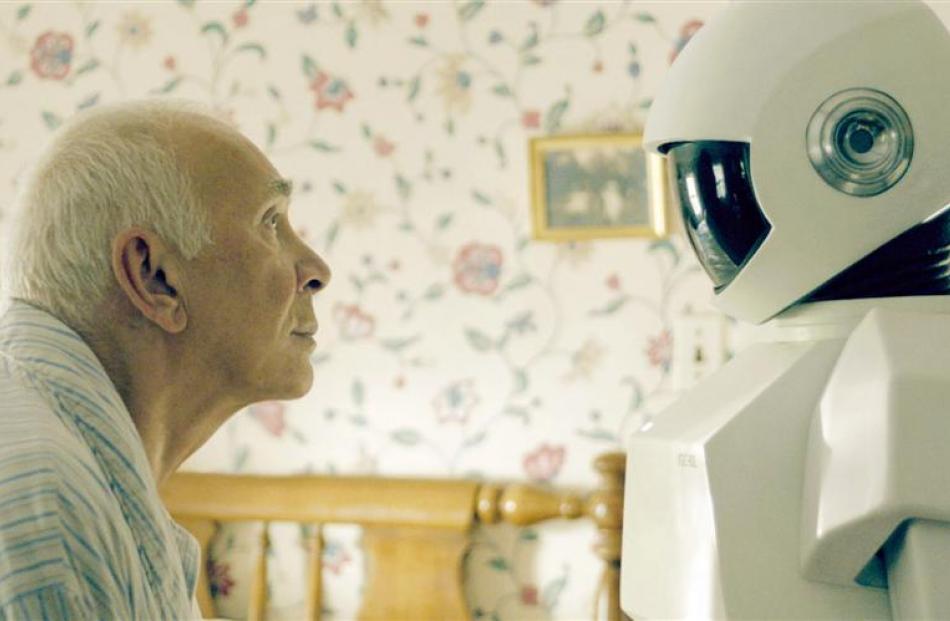Frank Langella searches for a connection with his UGC-60L home care robot in Robot & Frank. Photo...