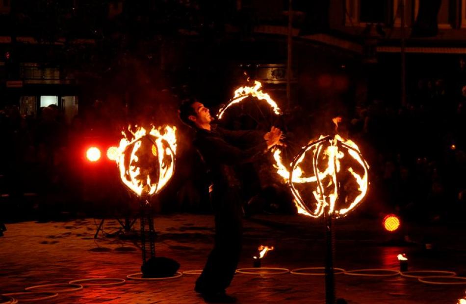 Freelance performance artist Jeff Robinson lights up the night in "Firestrom", a fire and...