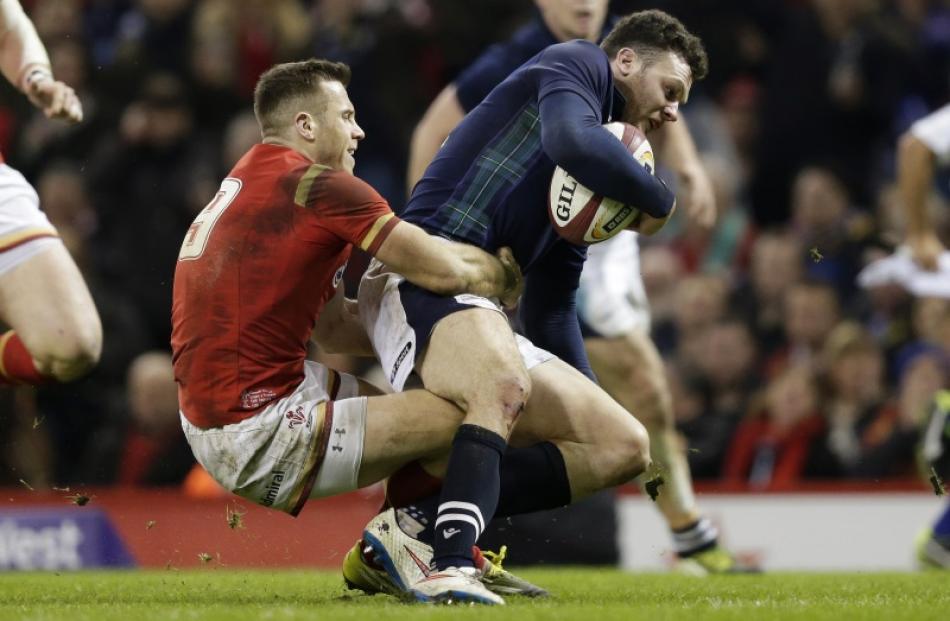 Gareth Davies from Wales couldn't stop Duncan Taylor's try for Scotland. Photo: Action Images via...