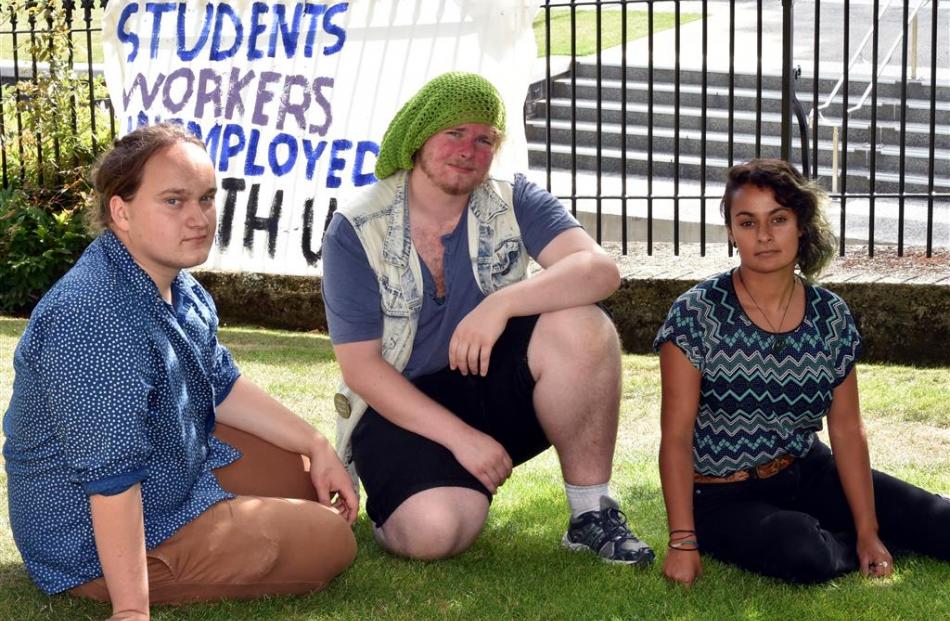 Gareth McMullen (20, left), Tyler West (20) and Roshana Fernando (21) outside the University of...