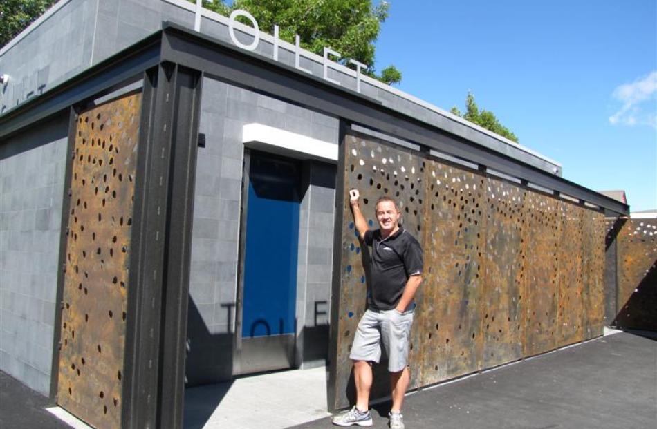 Gary Anderson checks out the "flash" new public toilets in Cromwell. Photo by Sarah Marquet.