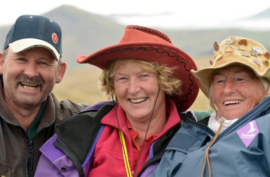 Gavin and Vicky Fox and Brenda Harland (right) share a moment during the Tussock Creek light...