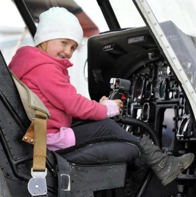 Georgia McHutchon (4), of Mosgiel, gets a feel for the Royal New Zealand Navy's Seasprite...