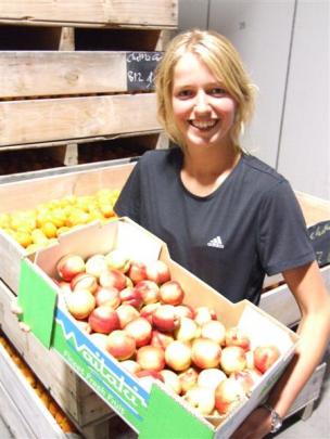 Geraldine Watt shows off a box of nectarines ready for sale. Photos by ODT.