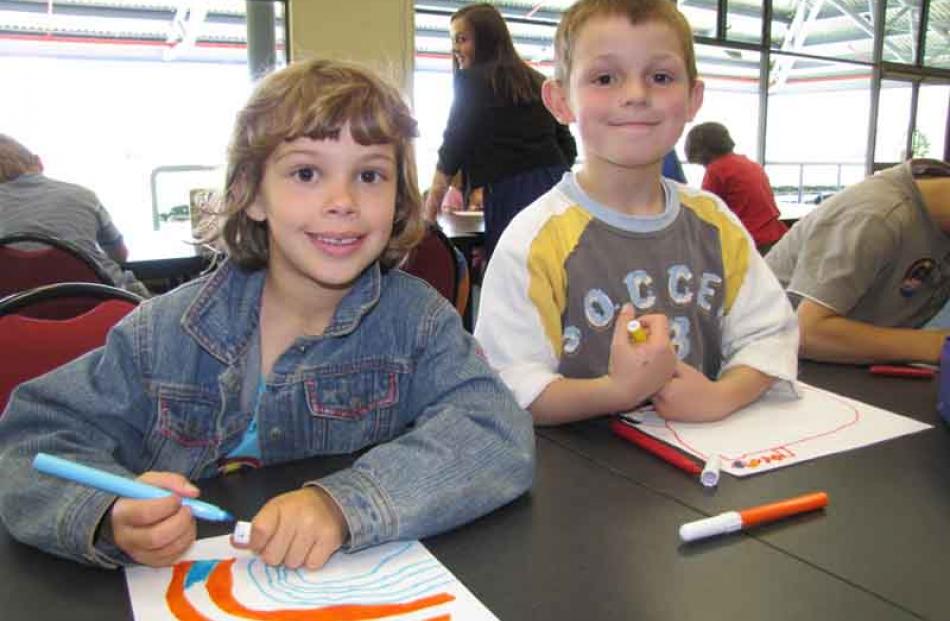 Getting stuck into creative expression was Zoe Barham (6) (left) and Cody Campbell (5). Photos by...