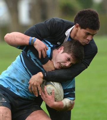 Going nowhere ... Waitaki Boys' High School centre Loni Fisiihoi holds King's High School hooker...