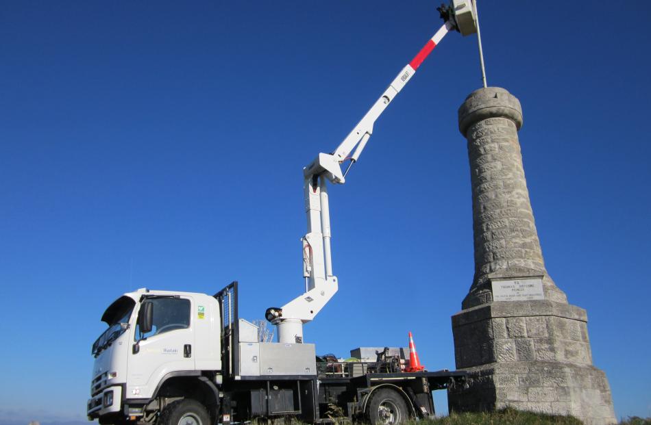 Graeme Clark and Steve McMurtrie work from the Network Waitaki Contracting cherry picker. Photo...