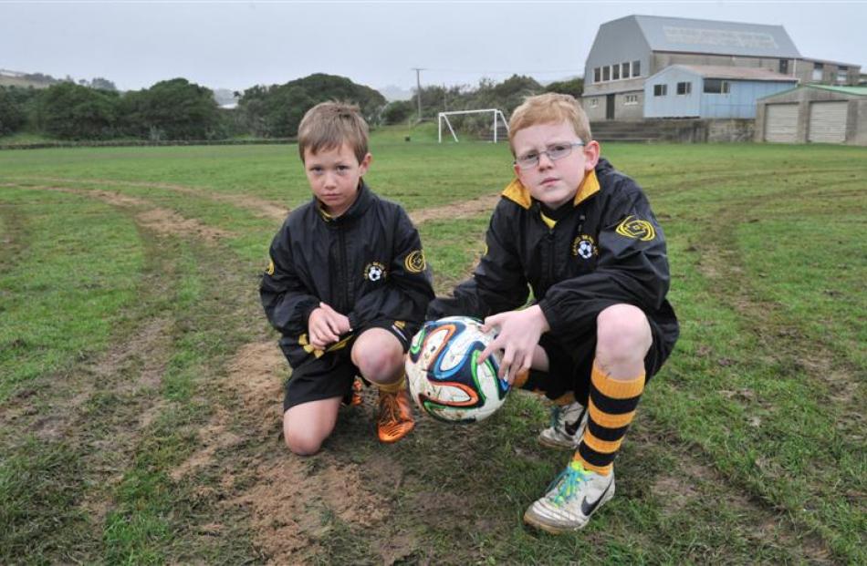Grants Braes Football Club junior players Dylan Mitchell (8, left) and Connor Cooper (10) survey...