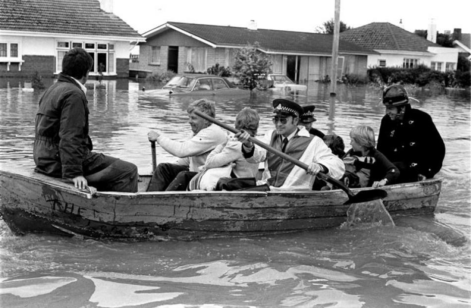 Grasmere  residents being rescued by rowing boat during Invercargill's big  flood of 1984.