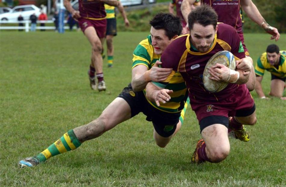 Green Island winger Matt McCutcheon (left) is not in time to prevent Alhambra-Union fullback...