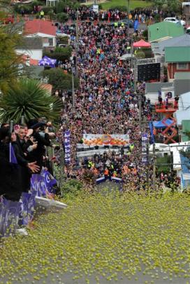 Green jaffas pour down Dunedin's Baldwin St in the 2013 Cadbury Jaffa Race yesterday. The first...