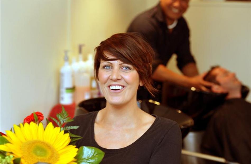 Hairworks hairdresser Kirsty Peters  is surprised by a special delivery to the salon yesterday.