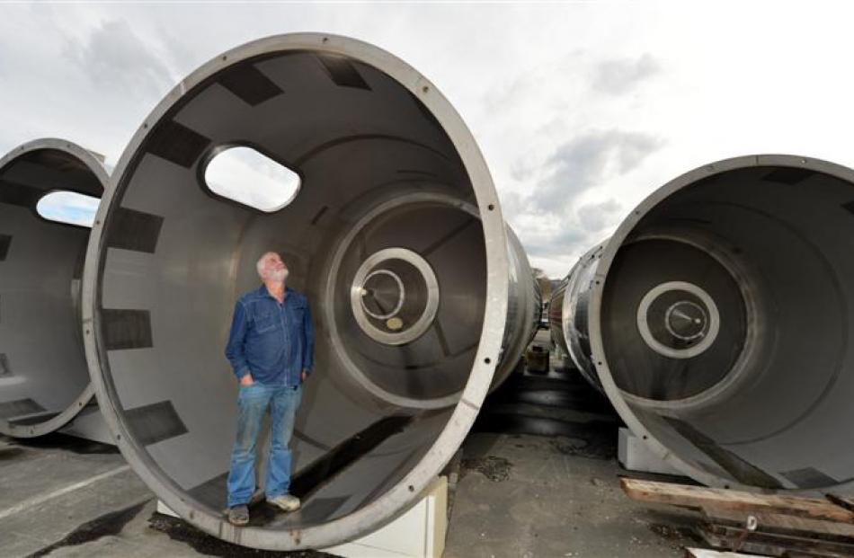 Hall Bros Transport Ltd owner Doug Hall stands in one of four new storage tanks, which are being...