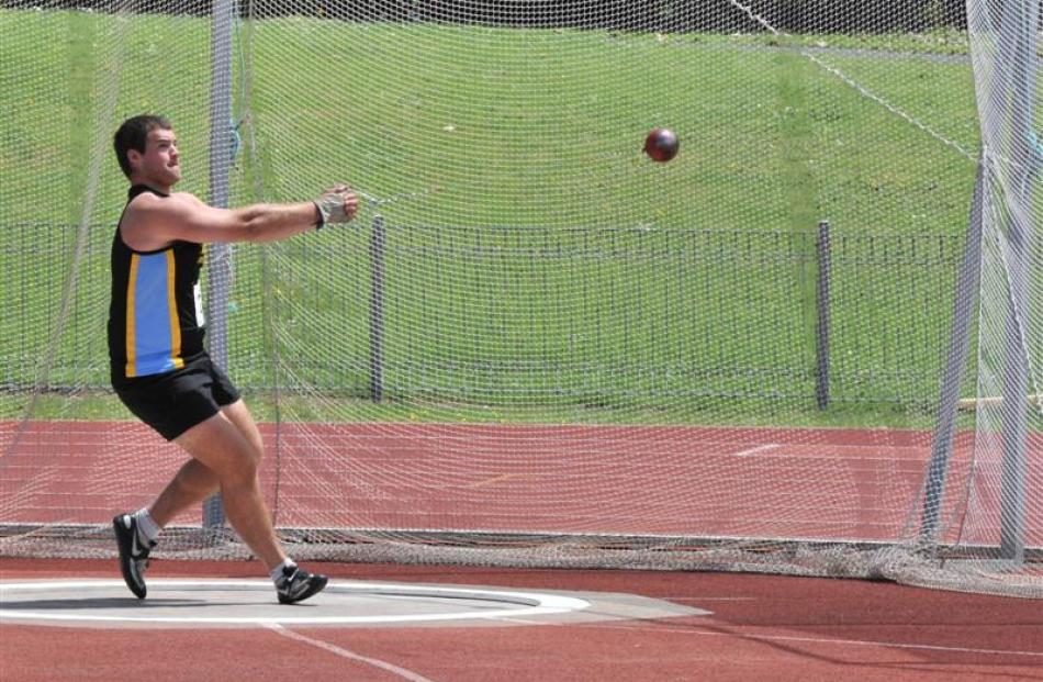 Hamish Finnie (Hill City-University) shows the form that won him the men's hammer throw at the...