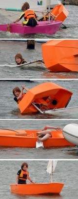 Hamish O'Malley-King goes for an unscheduled dip after capsizing his Optimist while participating...