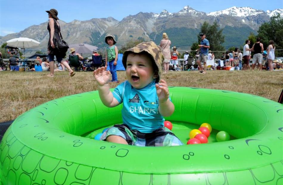 Harlan Mason (10 months) of Invercargill keeps cool in a paddling pool.