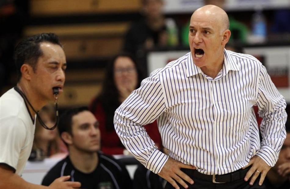 Hawkes Bay Hawks coach Tab Baldwin disputes a call with referee Apai Apai during an NBL game in...