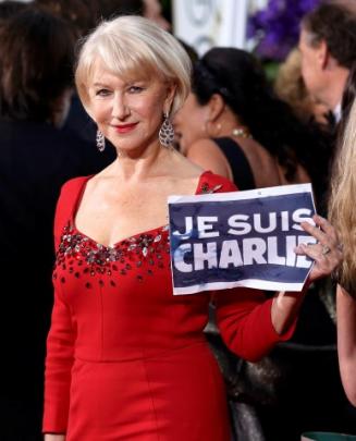 Helen Mirren holds a 'Je Suis Charlie' sign as she arrives at the 72nd Golden Globe Awards in...