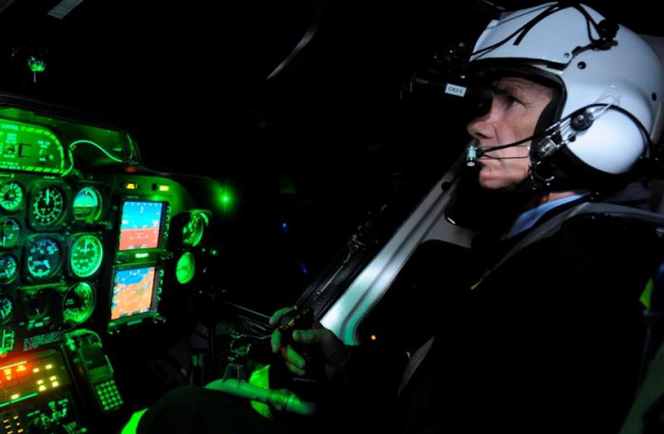 Helicopters Otago managing director and chief pilot Graeme Gale uses night vision goggles in the...