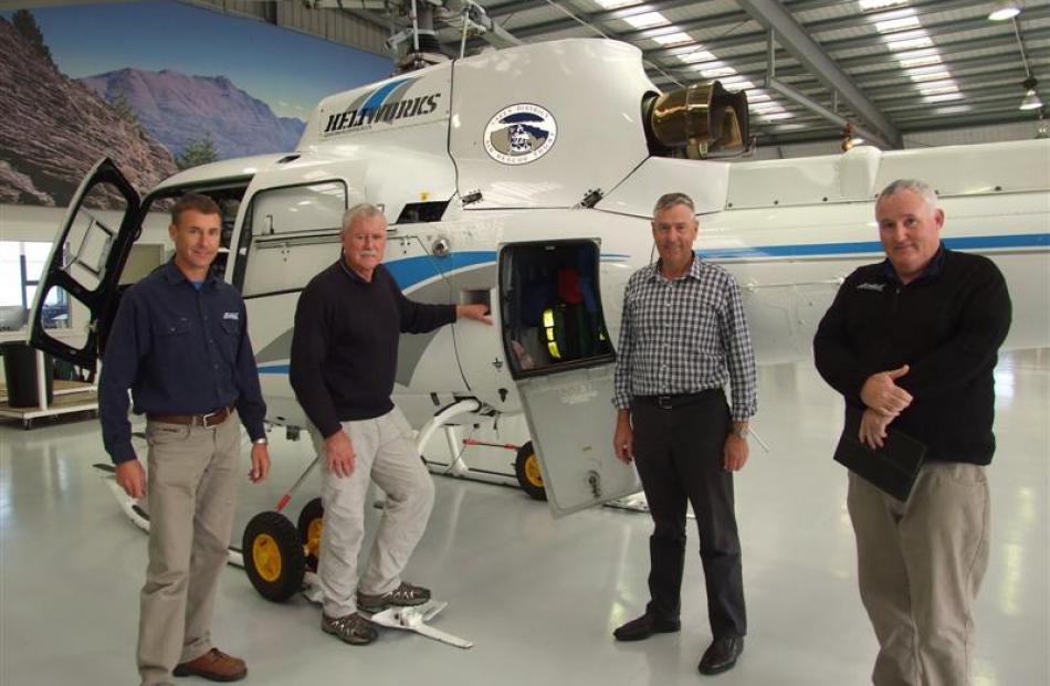 Heliworks pilot Shaun Clark (left), with (from left)  Lakes District Air Rescue Trust chairman...