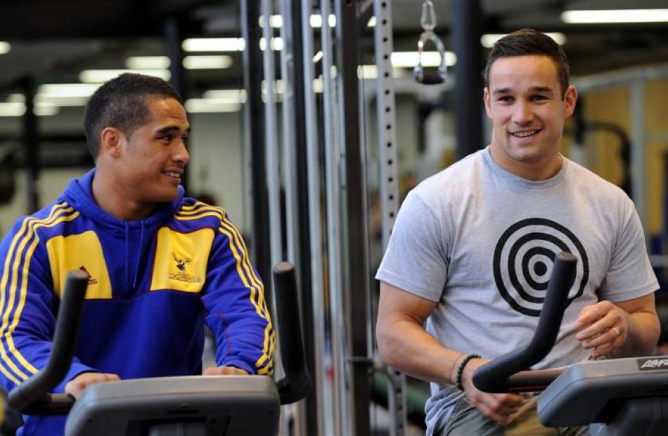 Highlanders Aaron Smith (left) and Tamati Ellison celebrate their selection in the All Blacks...