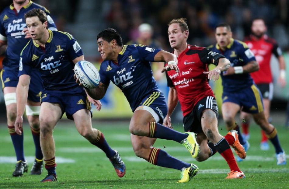 Highlanders centre Malakai Fekitoa makes a break against the Crusaders at Forsyth Barr Stadium in...