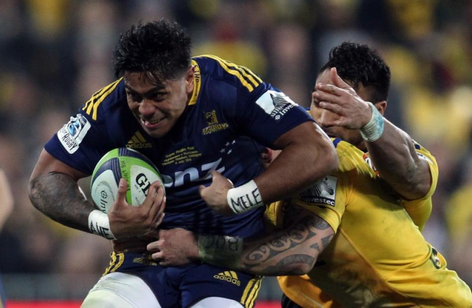 Highlanders centre Malakai Fekitoa on the charge against the Hurricanes.