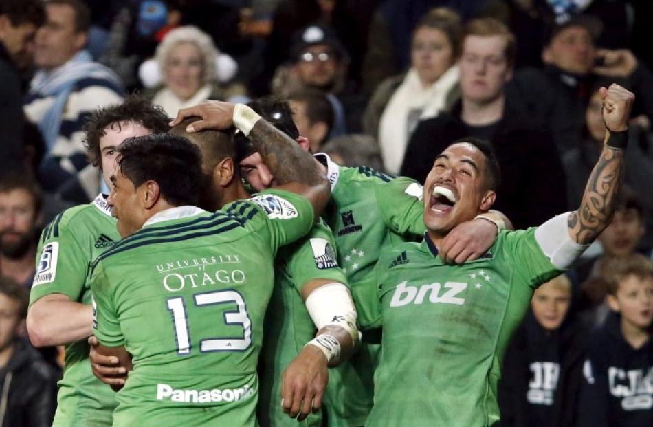 Highlanders players celebrate Patrick Osborne's try against the Waratahs. Photo Reuters