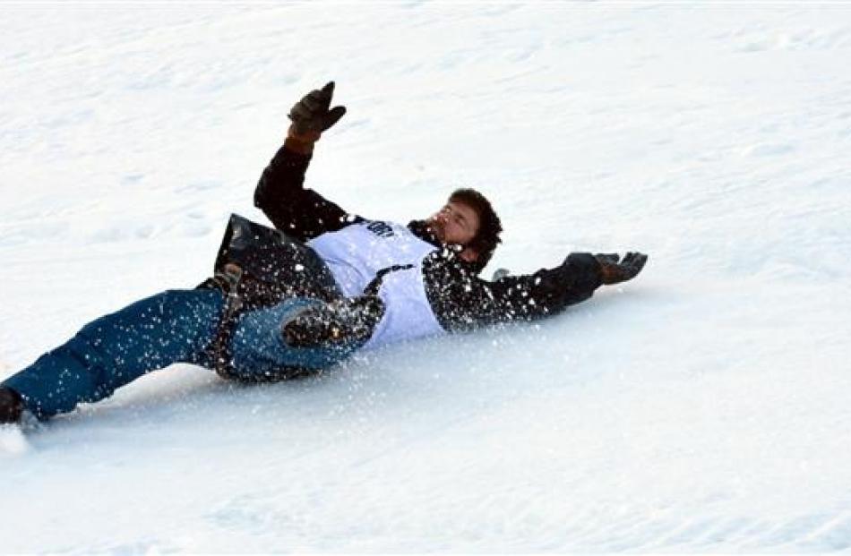 Hilton Scott,  of Frankton,  slides down the frozen course at the Queenstown Winter Festival dog...