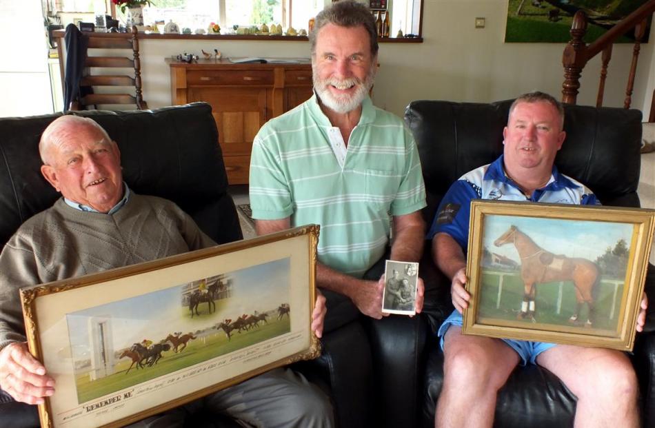 Holding some of the returned items are (from left) Laurie Pope (79), of New South Wales, with a...