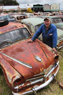 Horopito Motors owner Colin Fredricksen (62) with a few of the 4500 vehicles covering 6ha of...