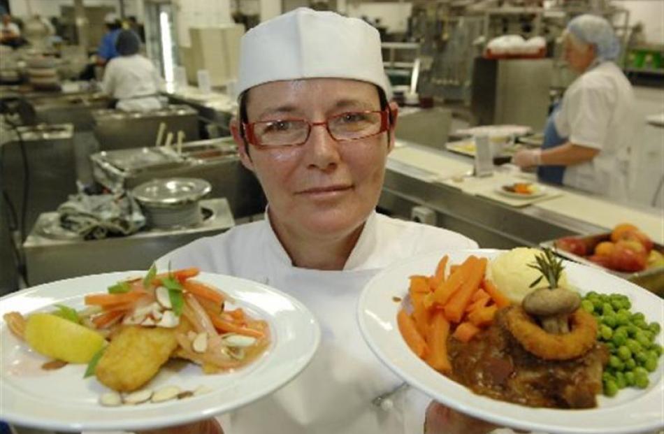 Otago District Health Board executive chef Sarah Marshall displays two meals from the new menu at...