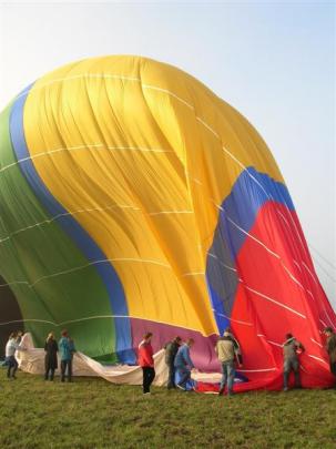 Hot-air ballooners are encouraged to help expel air from the balloon once landed. Photos by Rosie...