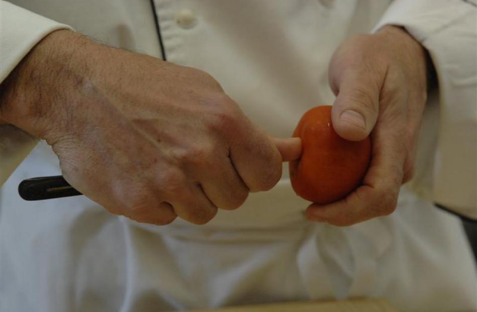 Before you start, put a pot of water on to heat. Then carefully cut out the tomato core with the...