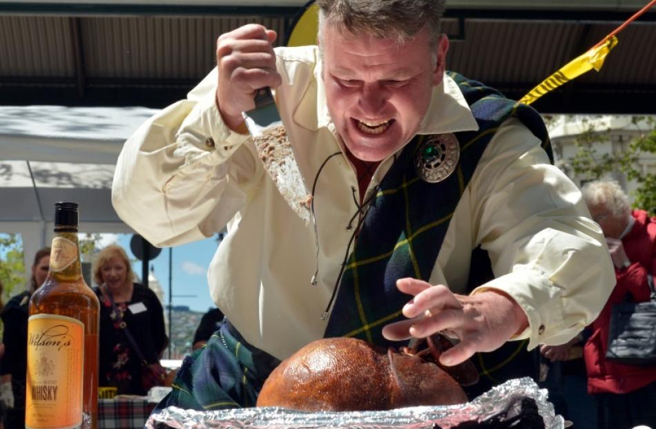 Iain Seatter passionately leads the haggis ceremony at St Andrew's Day celebrations in Dunedin on...