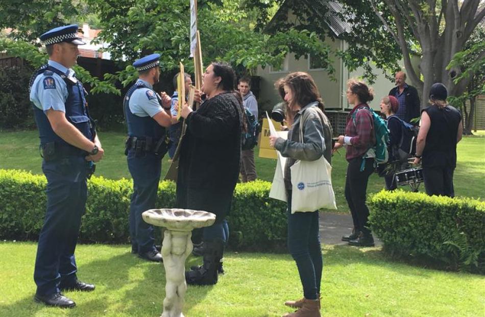 Protesters and police in the grounds of the Dunedin Club. Photo by Craig Baxter