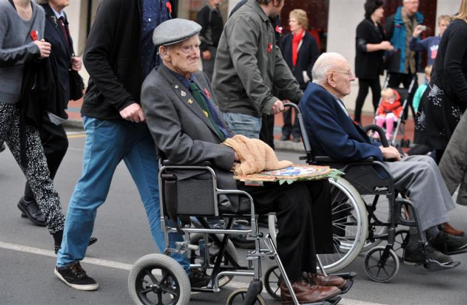 In the Mosgiel parade in Gordon Rd are (from left) Alan Anderson (92), of Wanaka, and Gerald...
