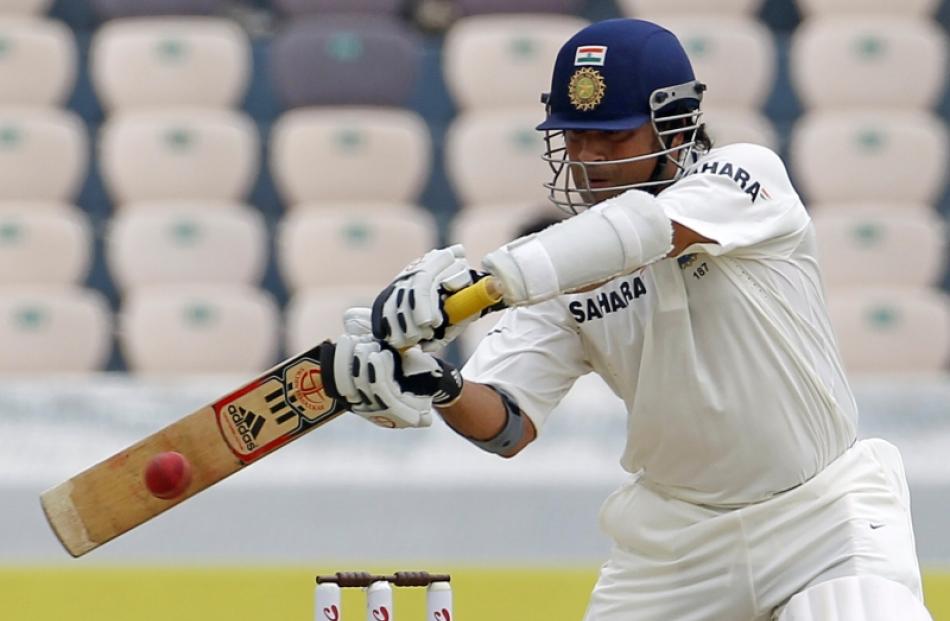 India's Sachen Tendulkar hits a shot during the first day of their first test cricket match...