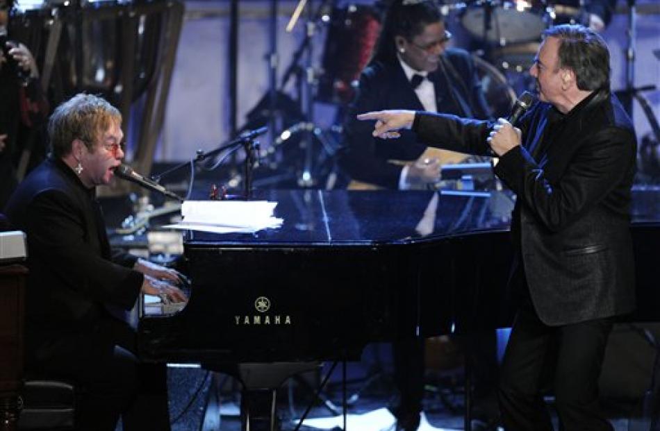 Inductee Neil Diamond, right, and Elton John perform.