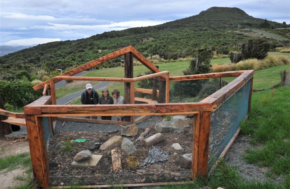 Inspecting  the new tuatara viewing pen are (from left) Orokonui Ecosanctuary volunteer Brendan...