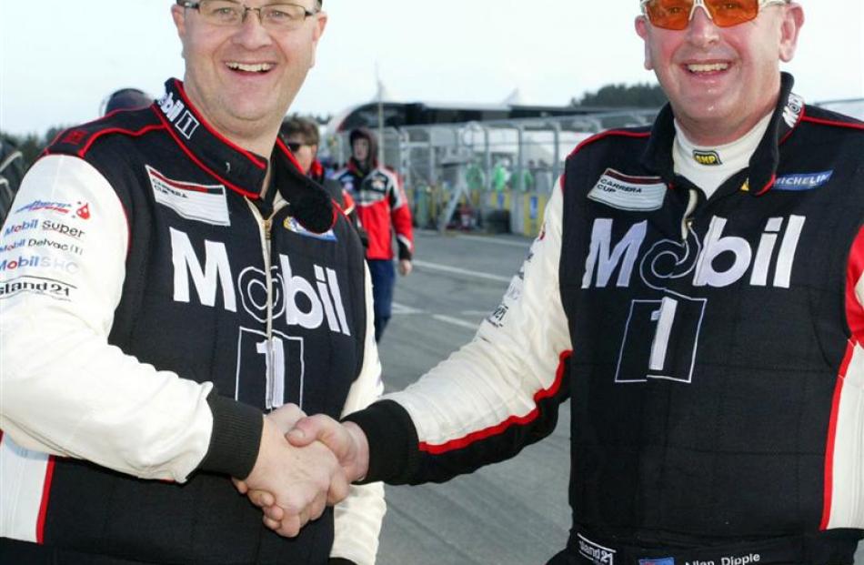 Invercargill's Scott O'Donnell (left) shakes hands with driving partner Allan Dippie, of Dunedin,...