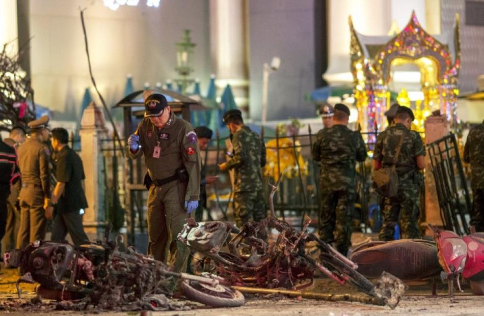 Security forces at the site of the blast in central Bangkok. REUTERS/Athit Perawongmetha